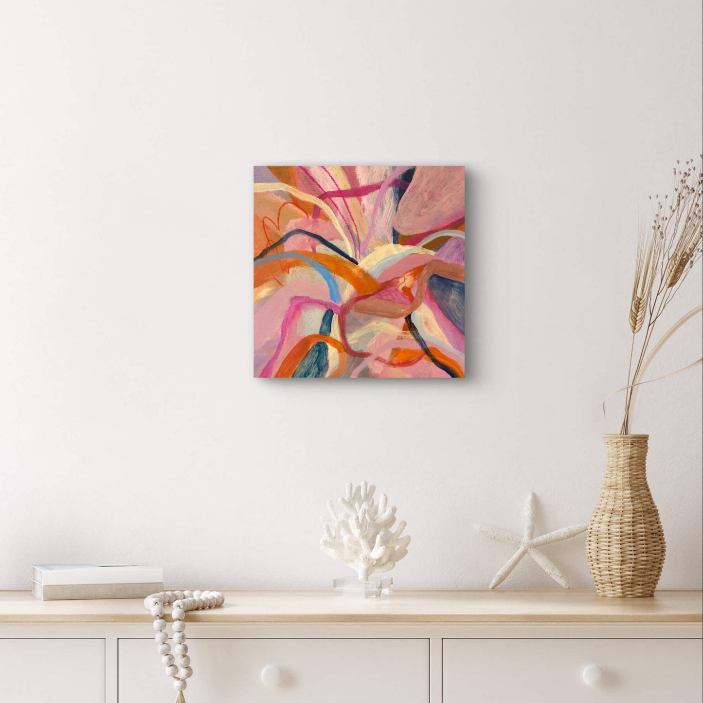 Hibiscus Dreaming Print Unframed 30x30 hanging above a console table with homeware decor