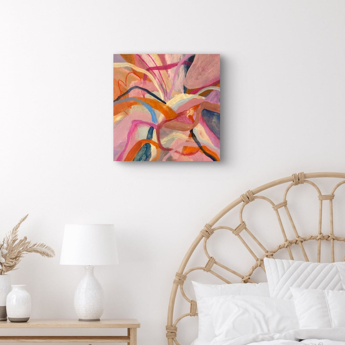 Hibiscus Dreaming Abstract Painting Print Unframed 40x40cm hanging above a cane bed with white linen