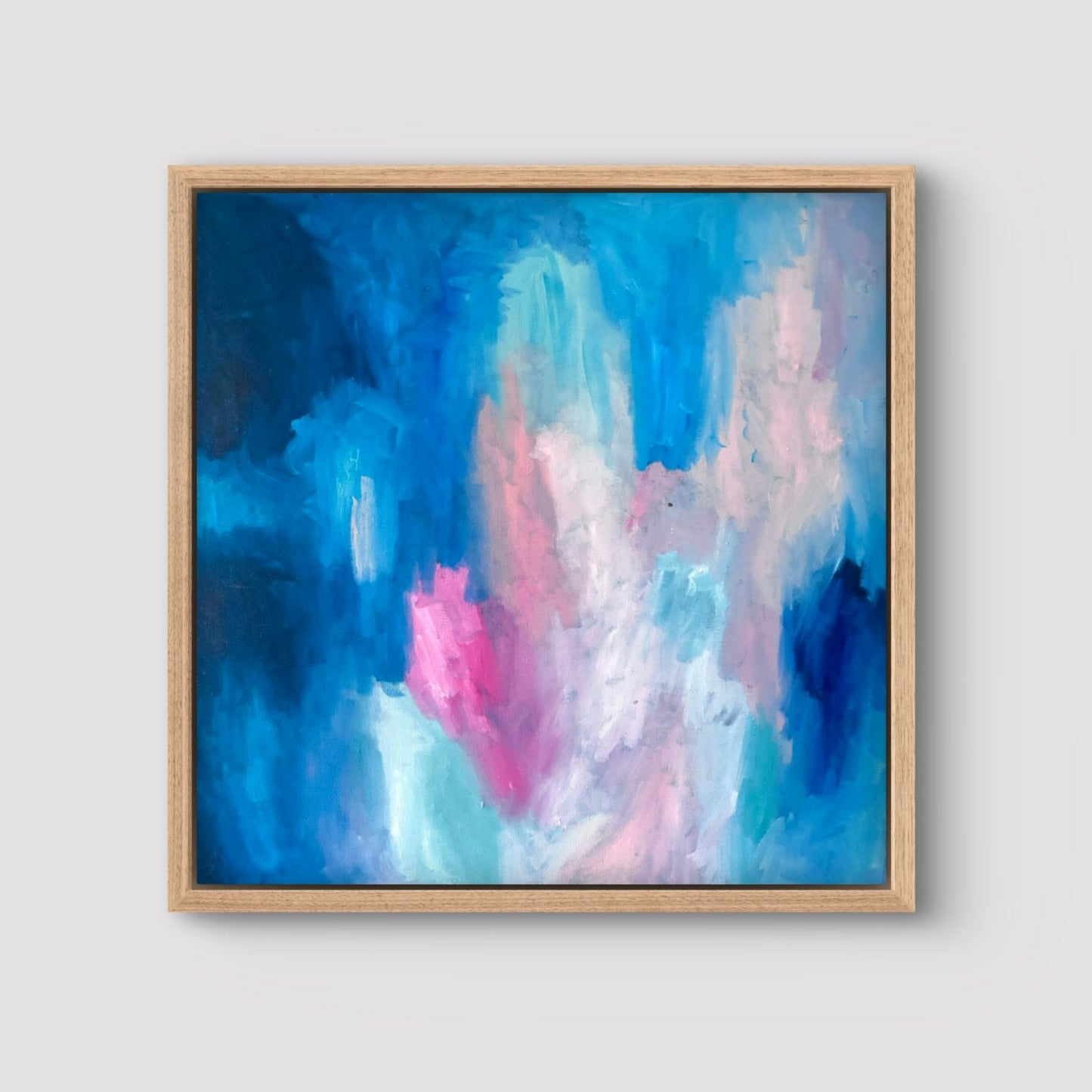 dark blue, peach and pink oil abstract painting in an oak frame
