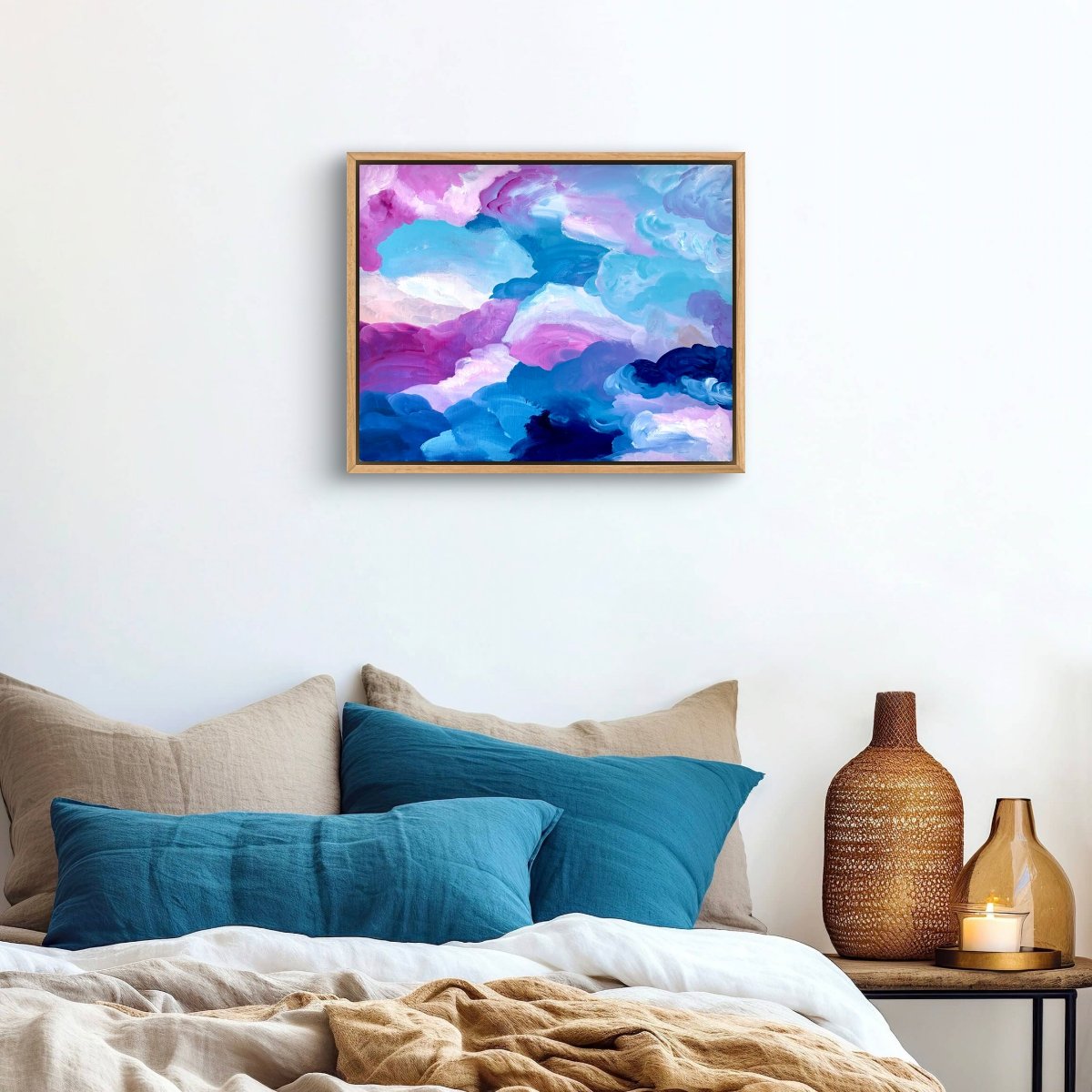 original artwork framed in tasmanian oak sitting on a white wall behind bed with teal pillows