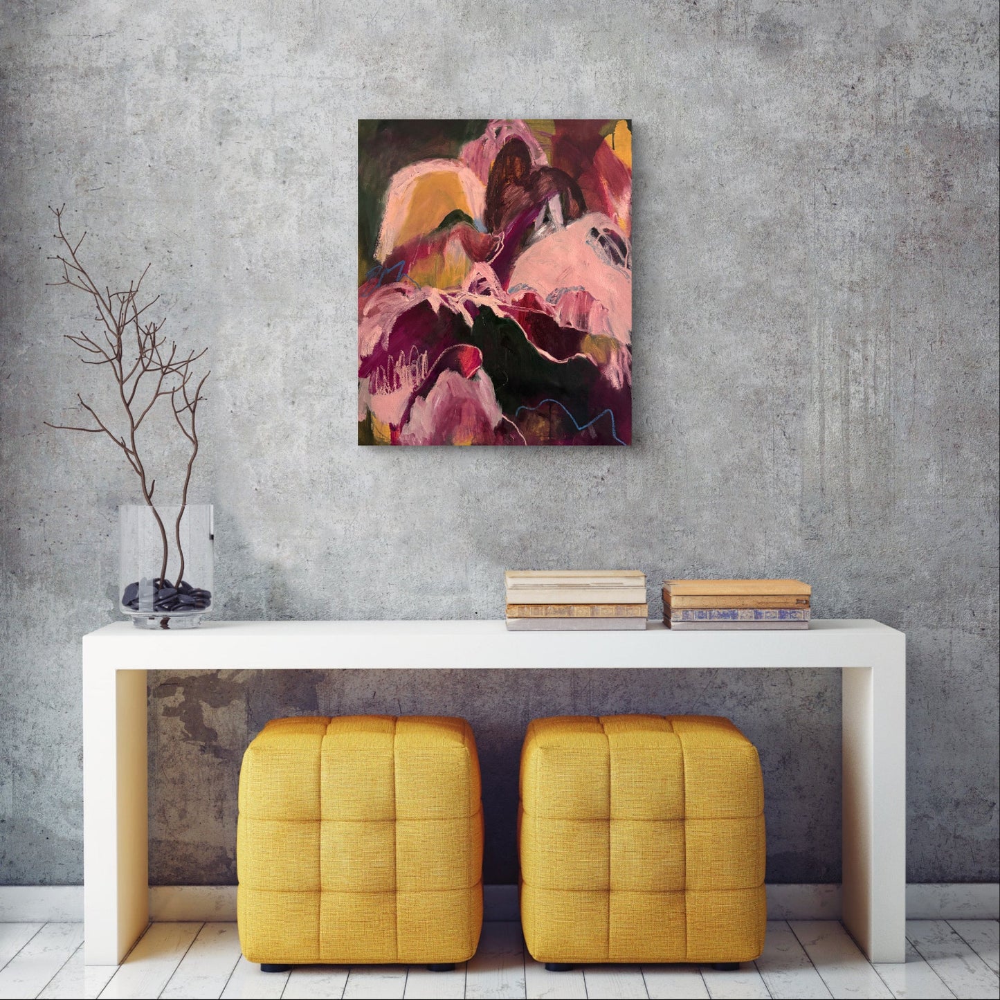 Abstract painting on a gray wall above a white console table with yellow stools.