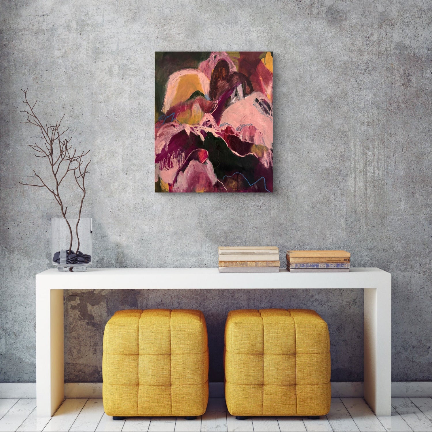 Abstract painting on a gray wall above a white console table with yellow stools.