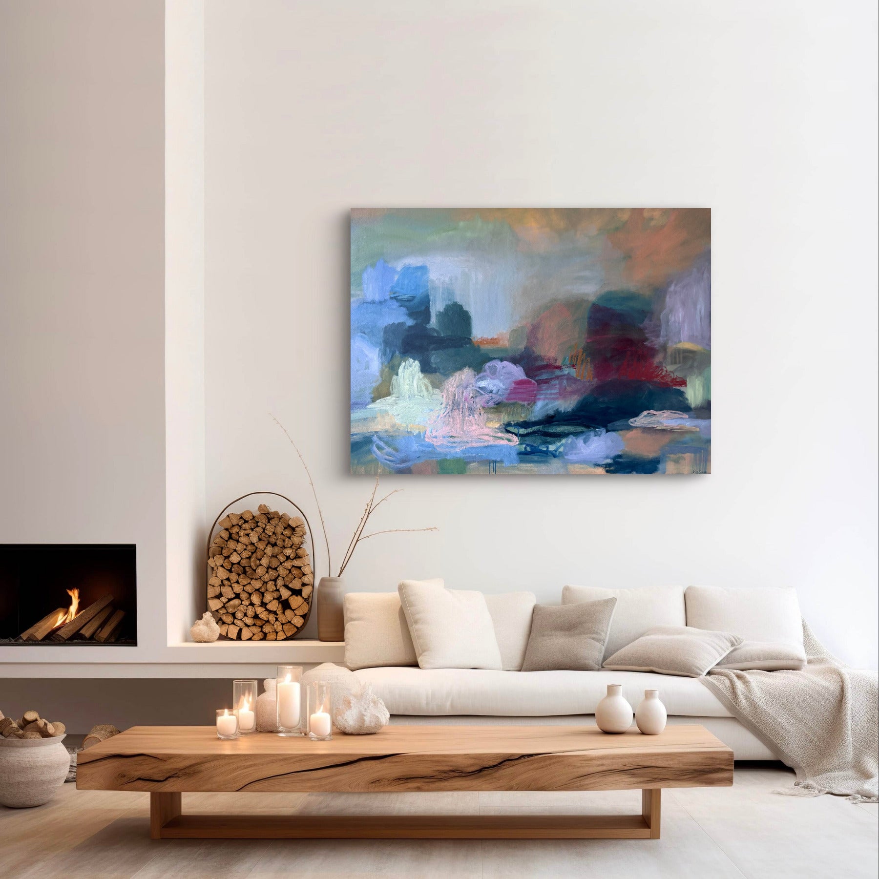 Modern living room with a colorful abstract painting on the wall, white sofa, and wooden coffee table.