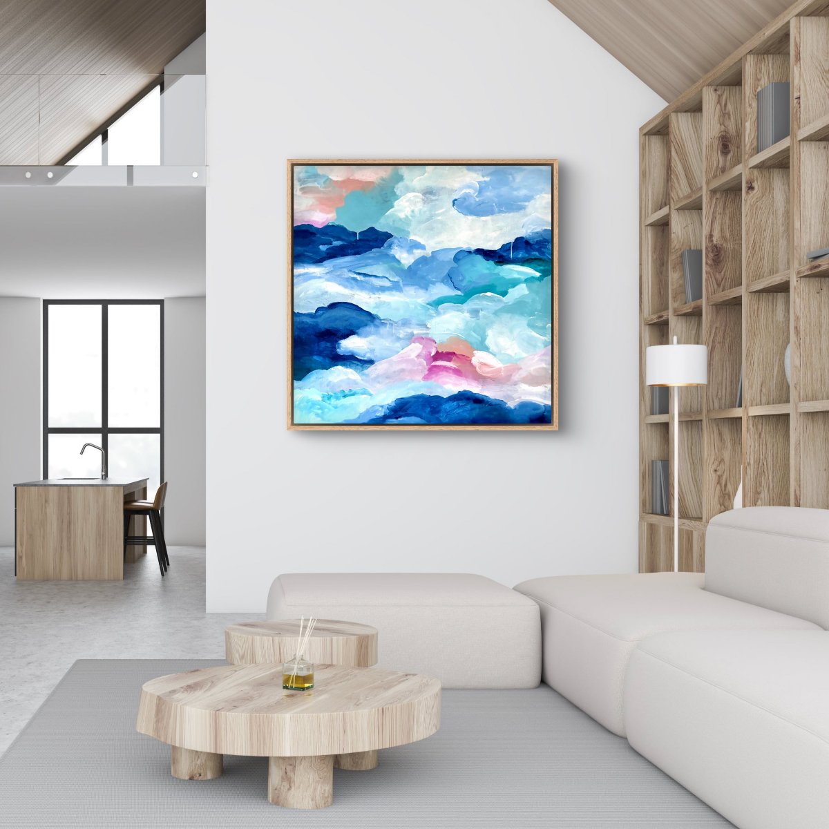 Framed original artwork of abstract clouds of blue, green, white and peach in a neutral lounge room