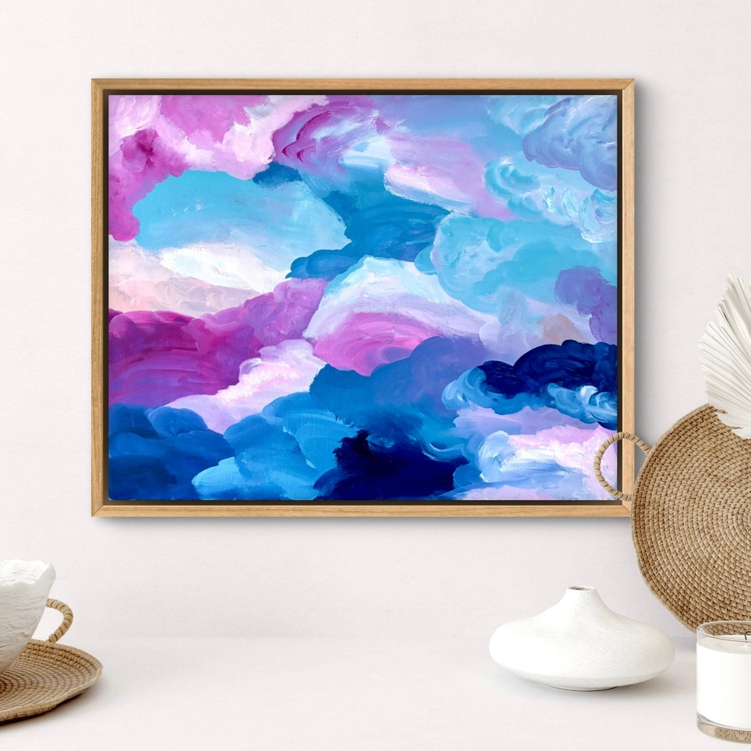 original artwork framed in tasmanian oak sitting on a white wall with homewares in front