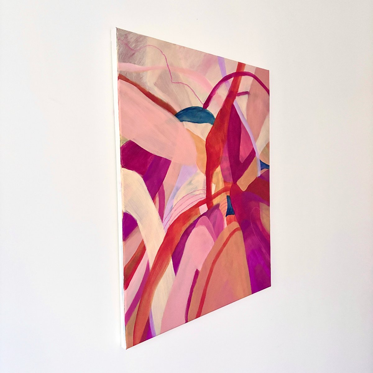 Framed Original painting of abstract botanical with bright pink, orange and yellow colours on a side angle