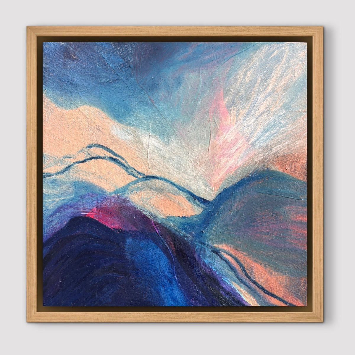 Blue and peach abstract landscape in an oak frame