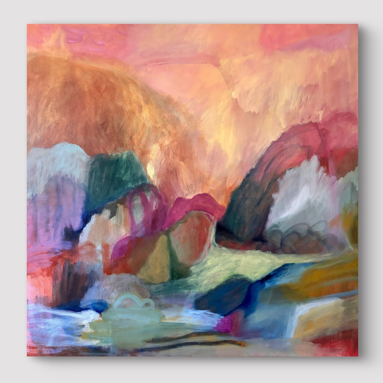 Abstract painting on a white wall with geometric patterns above and below.